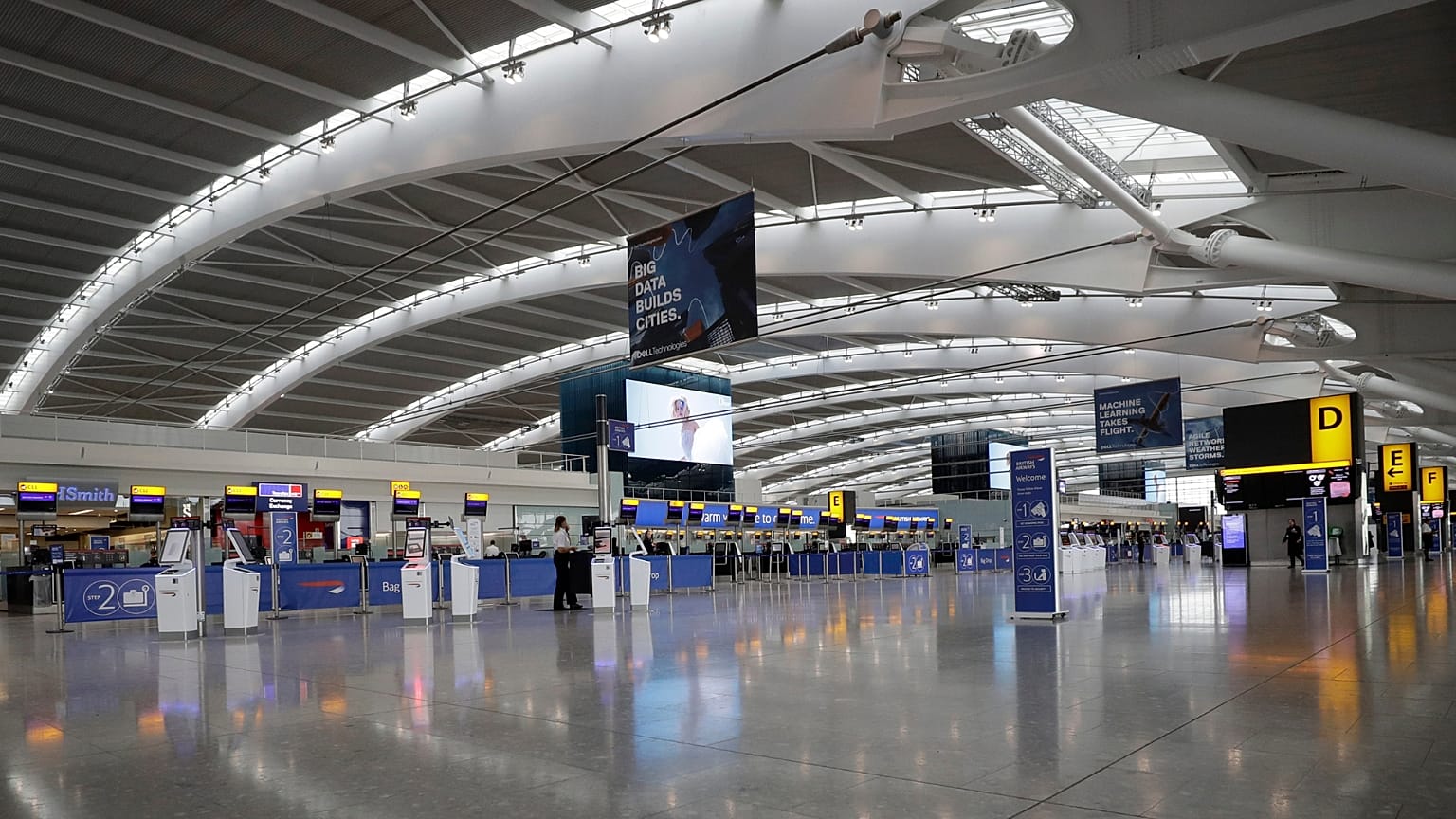 Terminal 5 at Heathrow Airport in London stands empty of passengers as staff standby to help. 