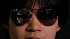 Image shows Bryan Chiang wearing his ChatGPT eyewear prototype that combines augmented reality glasses with software called RizzGPT