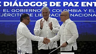 Cuban President Miguel Diaz-Canel shakes hands with ELN commander Antonio Garcia during a bilateral ceasefire agreement in Havana, Cuba, Friday, June 9, 2023