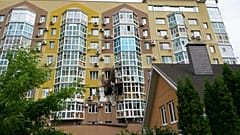 Broken windows and traces of fire are seen after a drone fell at a residential building in Voronezh, Russia, Friday, June 9, 2023. 