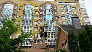 Broken windows and traces of fire are seen after a drone fell at a residential building in Voronezh, Russia, Friday, June 9, 2023. 