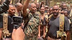 In this photo released by the Sudanese Army on Tuesday, May 30, 2023, Gen. Abdel-Fattah Burhan visits the troops in Khartoum, Sudan.