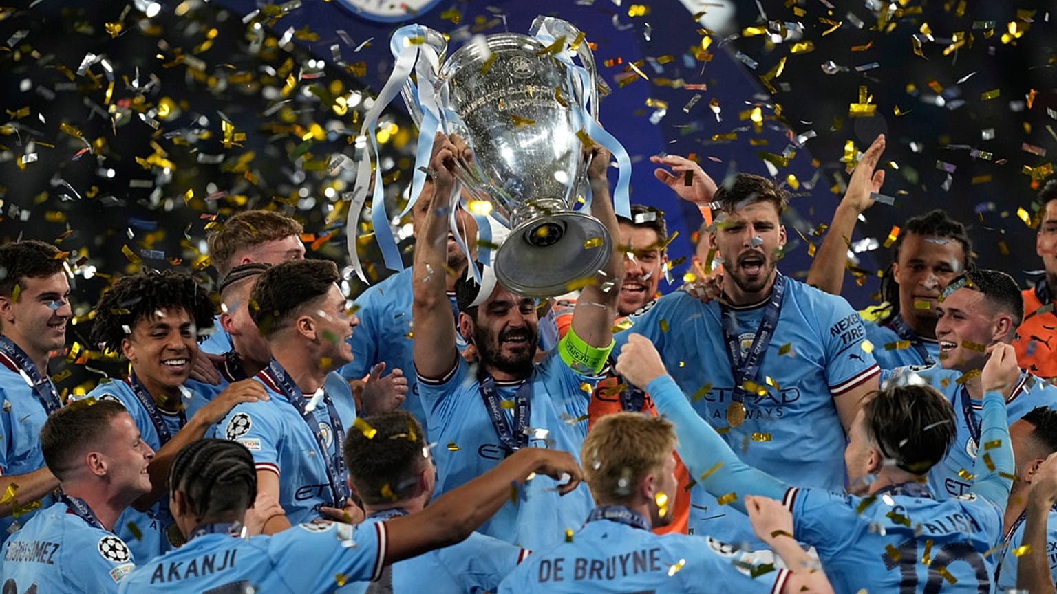 Manchester City's Ilkay Gundogan holds up the trophy after winning the Champions League final against Inter Milan at the Ataturk Olympic Stadium, Turkey.