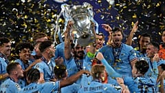 Manchester City's Ilkay Gundogan holds up the trophy after winning the Champions League final against Inter Milan at the Ataturk Olympic Stadium, Turkey.