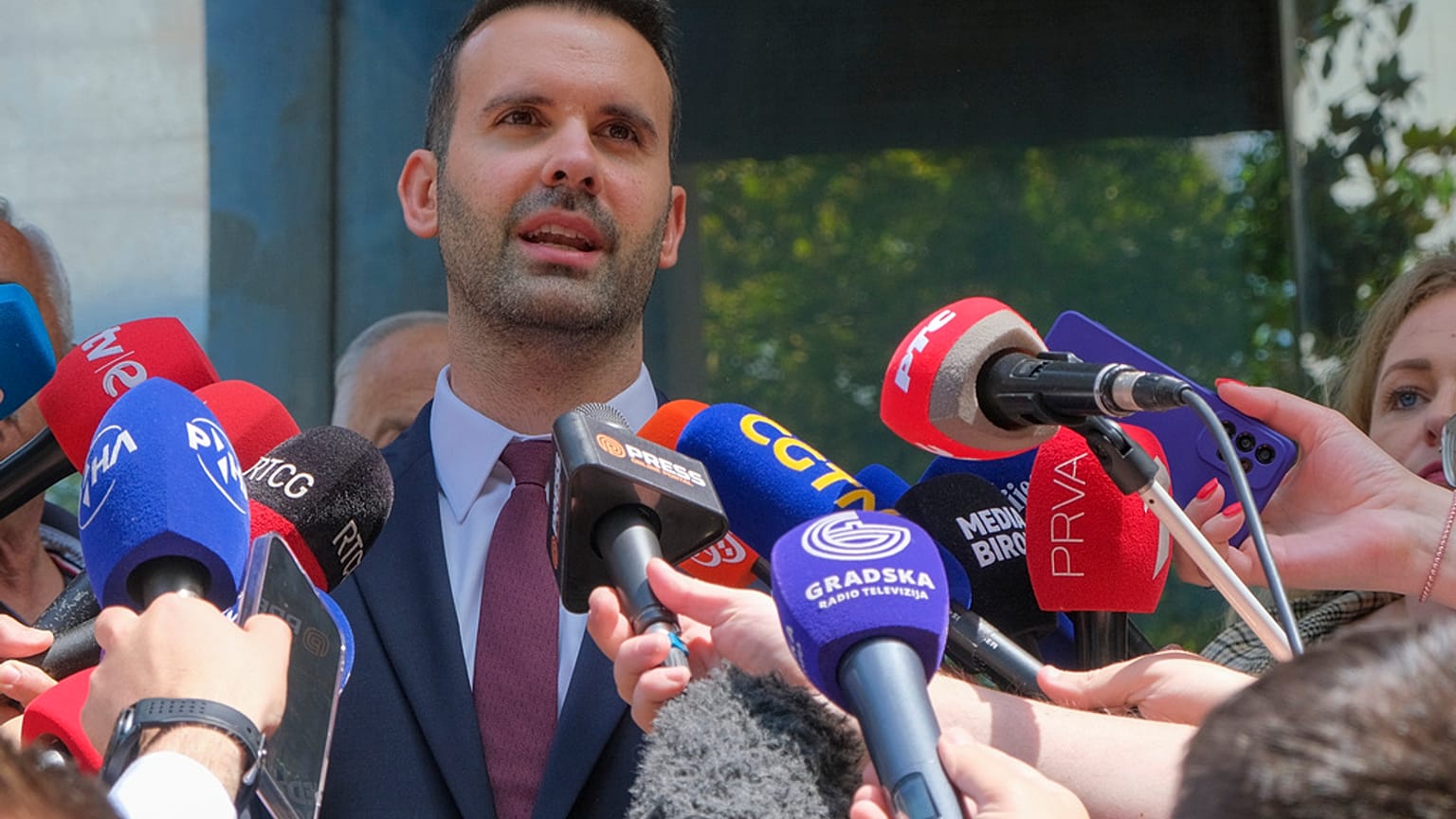 Milojko Spajic, president of the centrist Europe Now party talks to the media after voting at the polling station in Montenegro's capital Podgorica, Sunday, June 11, 2023.
