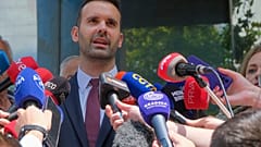 Milojko Spajic, president of the centrist Europe Now party talks to the media after voting at the polling station in Montenegro's capital Podgorica, Sunday, June 11, 2023.