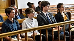 Young plaintiffs listen to arguments during a status hearing on 12 May 2021 in Helena, Montana.