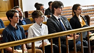 Young plaintiffs listen to arguments during a status hearing on 12 May 2021 in Helena, Montana.