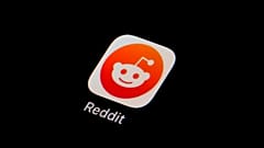 The Reddit app icon is seen on a smartphone.