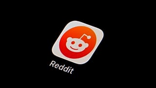 The Reddit app icon is seen on a smartphone.