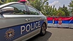Kosovo Serbs block the street near a Kosovo Police vehicle during a protest in the northern town of Zvecan. 5 June 2023