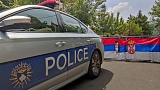 Kosovo Serbs block the street near a Kosovo Police vehicle during a protest in the northern town of Zvecan. 5 June 2023