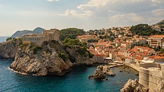 The coastal city of Dubrovnik crowns a rocky plateau that juts out into the Adriatic sea.