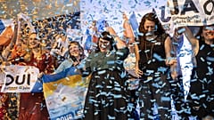 Supporters of the climate change bill throw confetti, in Bern, Switzerland, Sunday, June 18, 2023.