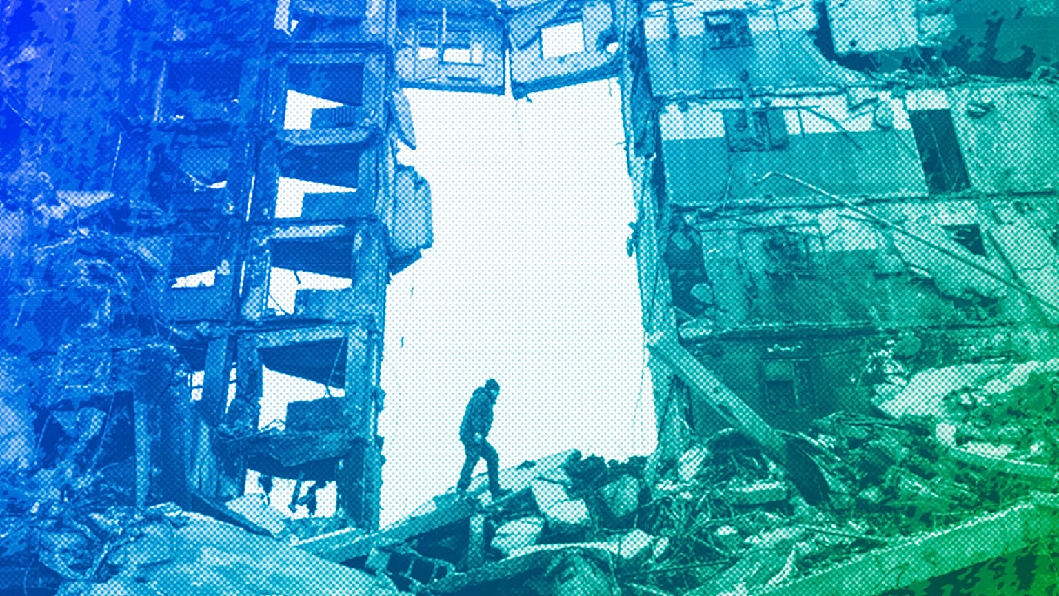 A resident looks for belongings in a destroyed apartment building in Borodyanka, April 2022