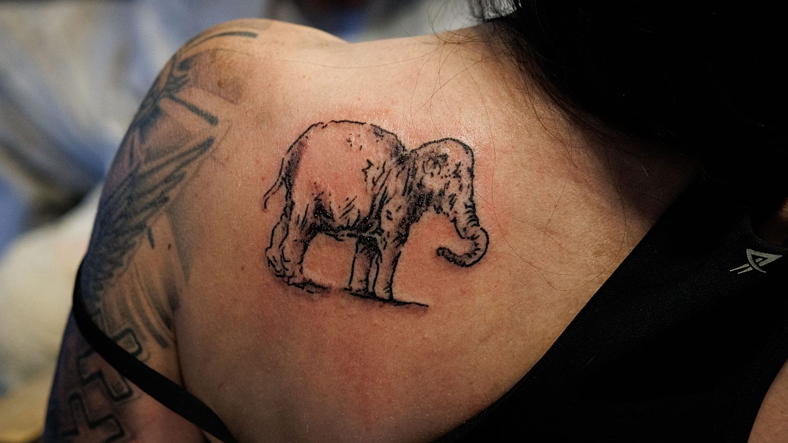 Detail of the shoulder of Lilian Ramcharan, a security manager at Rembrandt House Museum after she received a tattoo of 'Rembrandt’s elephant'.