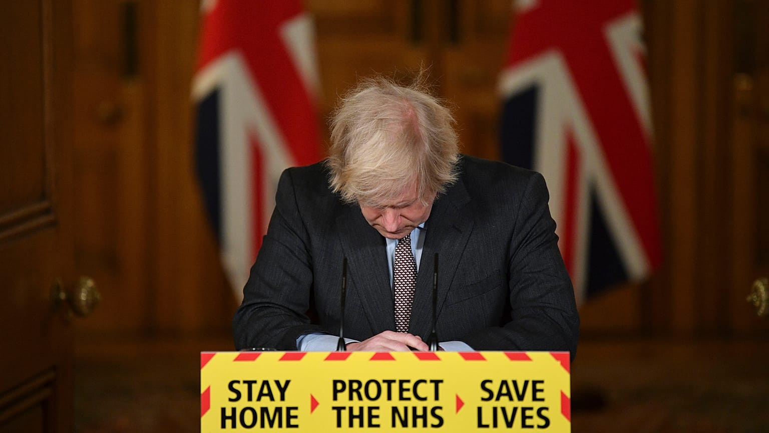 FILE - UK's then-PM Boris Johnson reacts while leading a virtual news conference on the COVID-19 pandemic, inside 10 Downing Street in London on Jan. 26, 2021