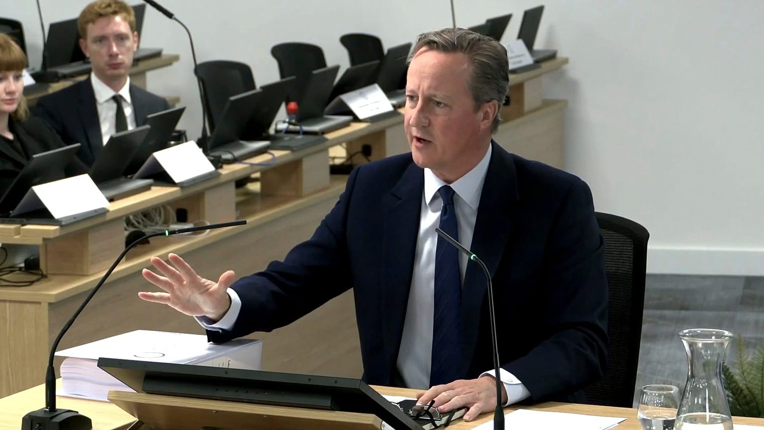 Britain's former prime minister David Cameron gives evidence to the UK COVID-19 Inquiry