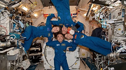 Clockwise from left, Expedition 68 Flight Engineers Anna Kikina of Roscosmos, Josh Cassada and Nicole Mann from NASA, and Koichi Wakata of JAZA gather inside the ISS.