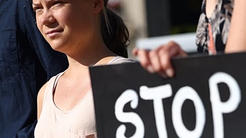 Swedish climate activist Greta Thunberg takes part in a demonstration for the climate at Place de la Republique on the sidelines of the New Global Financial Pact Summit, Paris