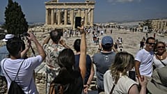 Temple during their visit at the Acropolis archaeological site in Athens