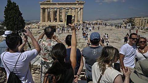 Temple during their visit at the Acropolis archaeological site in Athens