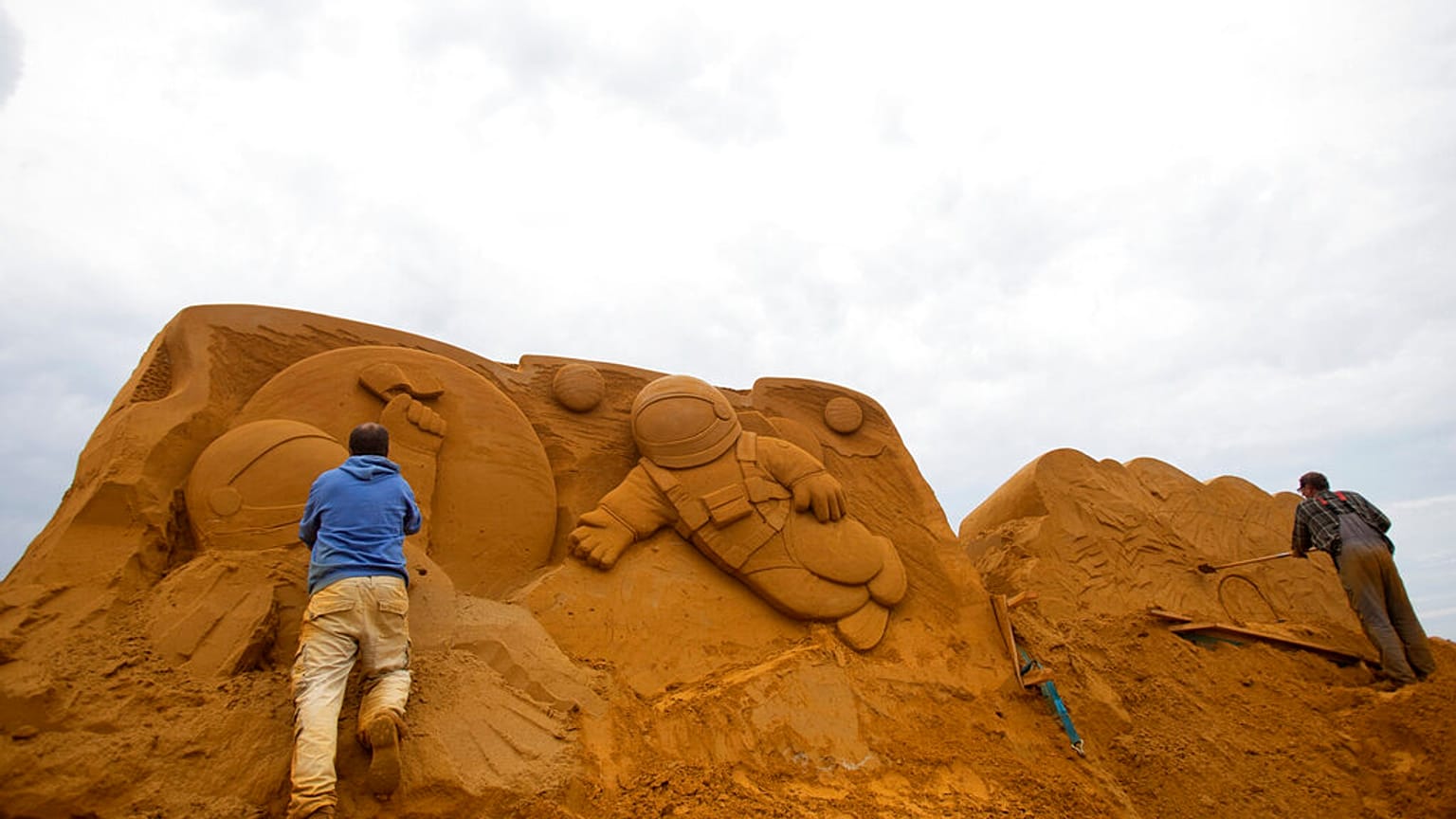Sand sculptors spend 10 days creating a fairy tale world on Belgian beach. 