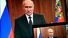 Vladimir Putin records an address from his office as Wagner troops advance toward Moscow