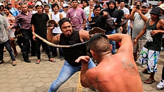 Catholic men participate in the dance called "Chinegro", which consists of hitting each other with swords made of stretched and dried bull penises. 