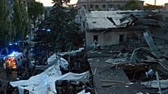 In this photo provided by the National Police of Ukraine, people clear the rubble in a restaurant RIA Pizza destroyed by a Russian attack in Kramatorsk, Ukraine, June 27, 2023