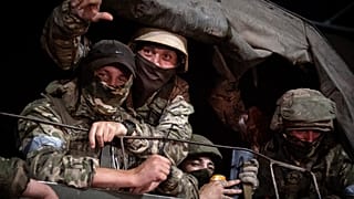 Members of Wagner group looks from a military vehicle in Rostov-on-Don late on June 24, 2023. 
