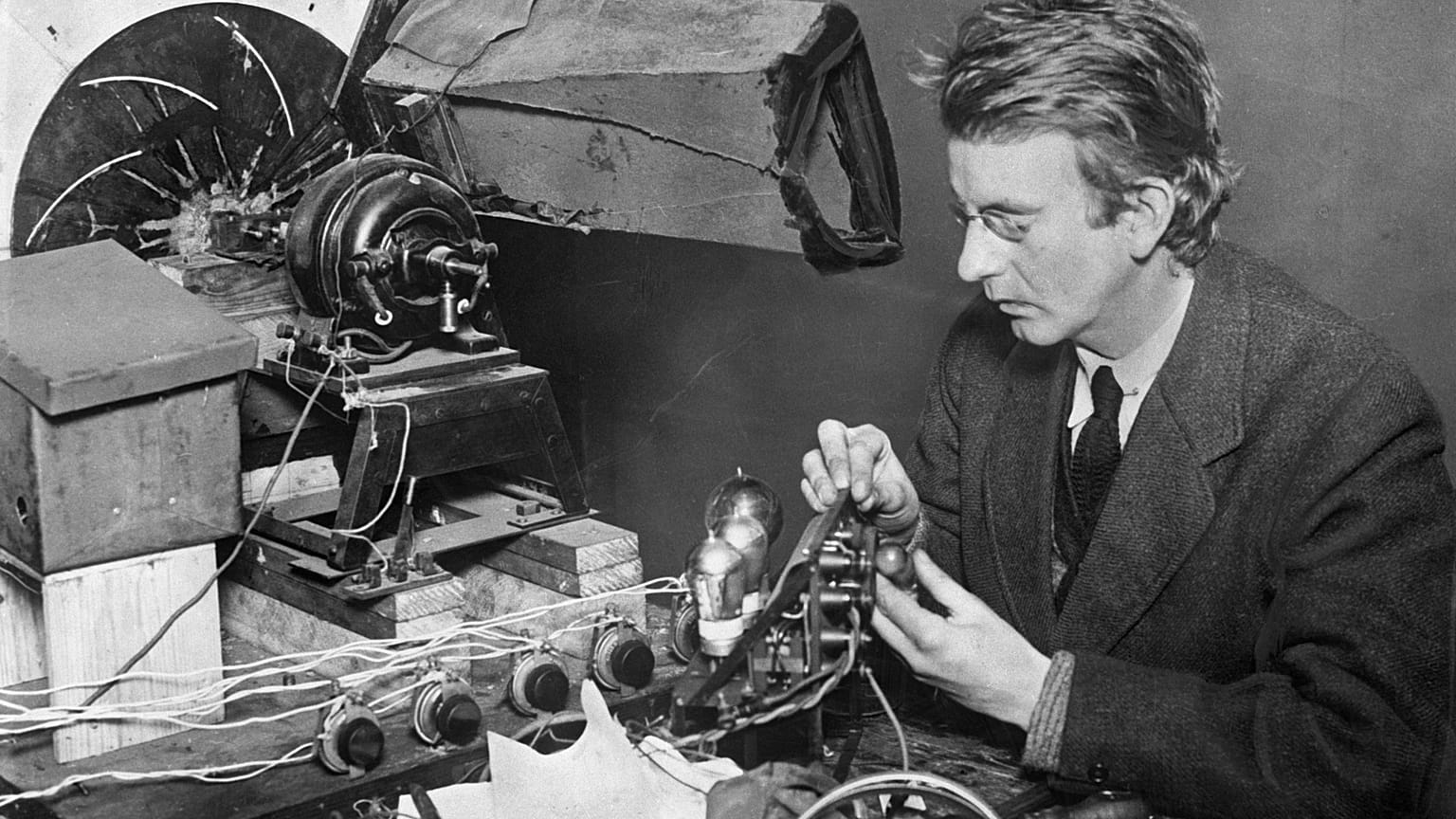 John Logie Baird, the inventor of television - originally known as wireless vision - at work adjusting a transmitter, 1925