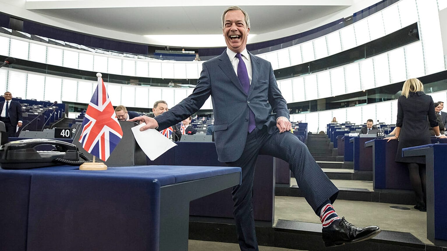 Former UK Independence Party (UKIP) leader and member of the European Parliament Nigel Farage shows his socks at the European Parliament in Strasbourg, France, 2019.