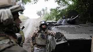 Ukrainian servicemen with their APC near Bakhmut, Donetsk