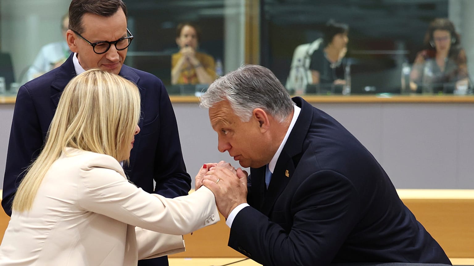 Hungary's Prime Minister Viktor Orban, right, speaks with Italy's Prime Minister Giorgia Meloni, center, and Poland's Prime Minister Mateusz Morawiecki,