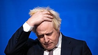 Britain's Prime Minister Boris Johnson speaks during a press conference in London, Saturday Nov. 27, 2021.