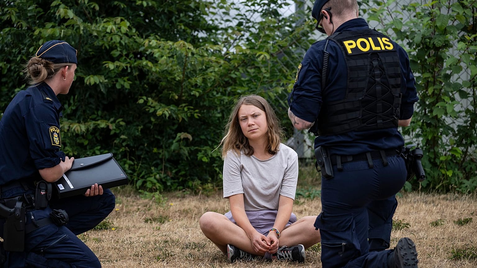 Police officers talk to the Swedish climate activist Greta Thunberg in Malmo, Sweden, 19 June 2023. 