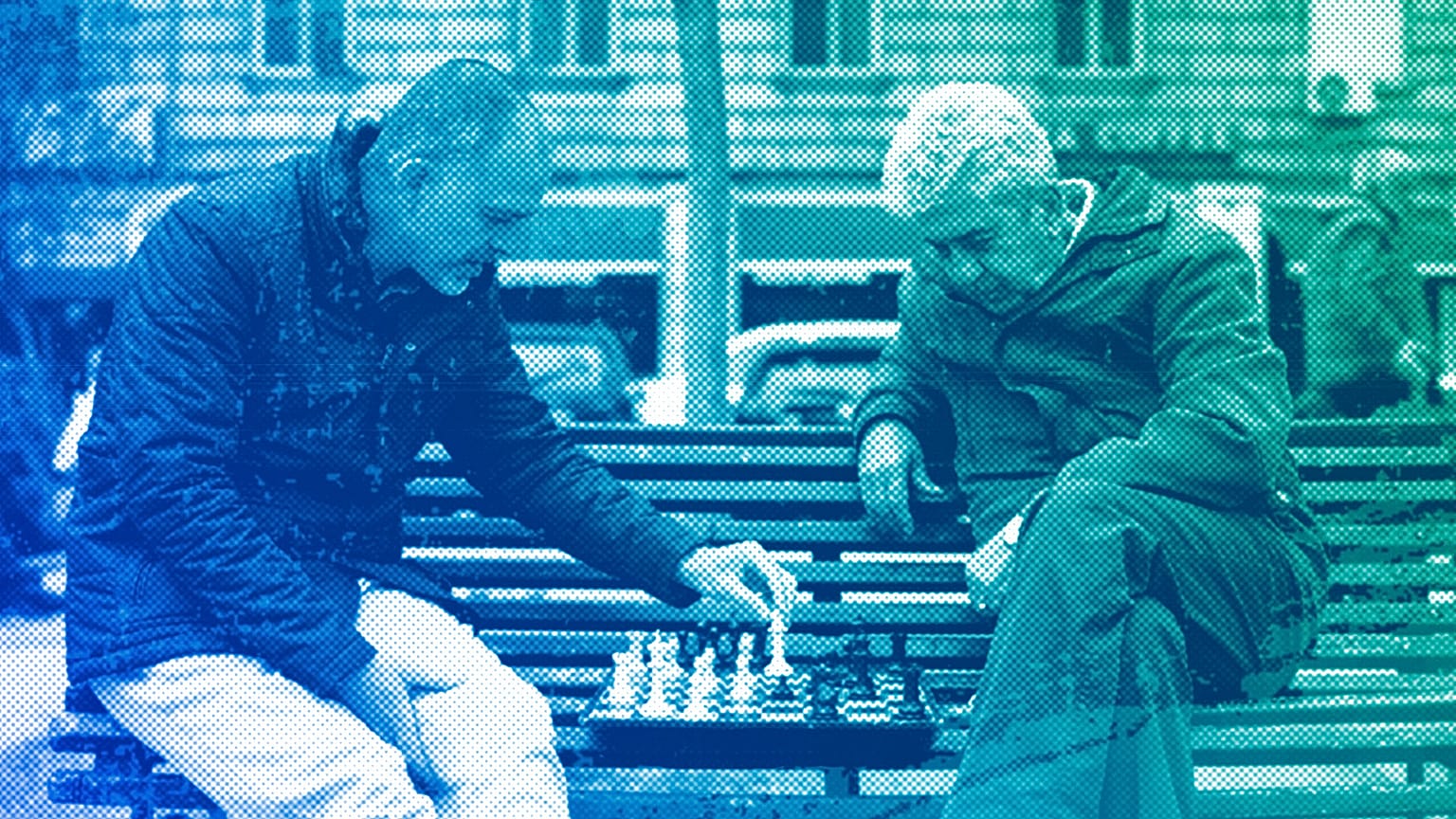 People play chess in a park outside the national theatre in Sofia, April 2023