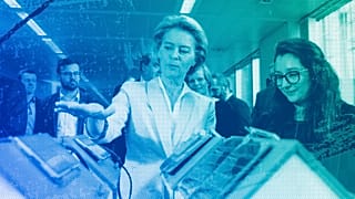European Commission President Ursula von der Leyen looks at an invention at the AI Xperience Center at the Vrije Universiteit Brussel) in Brussels, February 2020