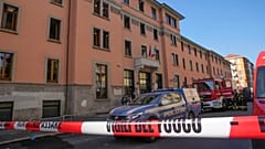 A firefighter truck and a police car are parked outside the "Casa per Coniugi" nursing home
