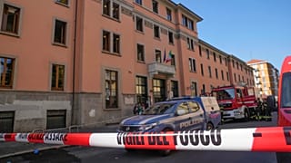 A firefighter truck and a police car are parked outside the "Casa per Coniugi" nursing home