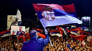 Bosnian Serb leader Milorad Dodik waves a Serbian flag at a protest in Banja Luka, the de facto capital of Republika Srpska.