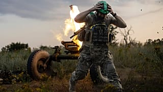 A Ukrainian serviceman of the 3rd Assault Brigade fires a 122mm mortar towards Russian positions at the front line, near Bakhmut, Donetsk region.