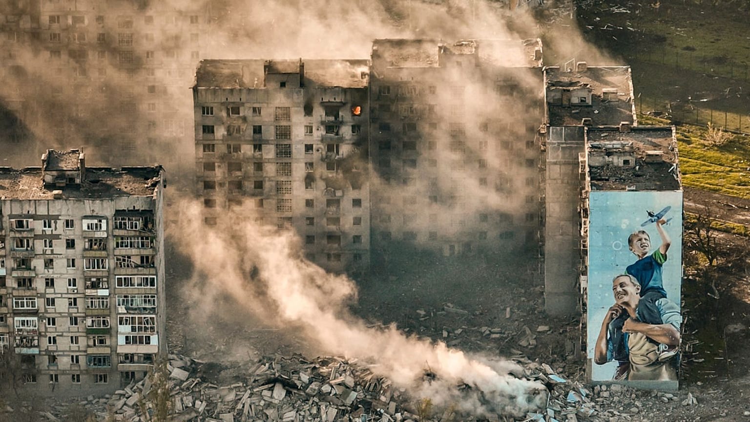 Smoke rises from a building in Bakhmut