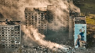 Smoke rises from a building in Bakhmut