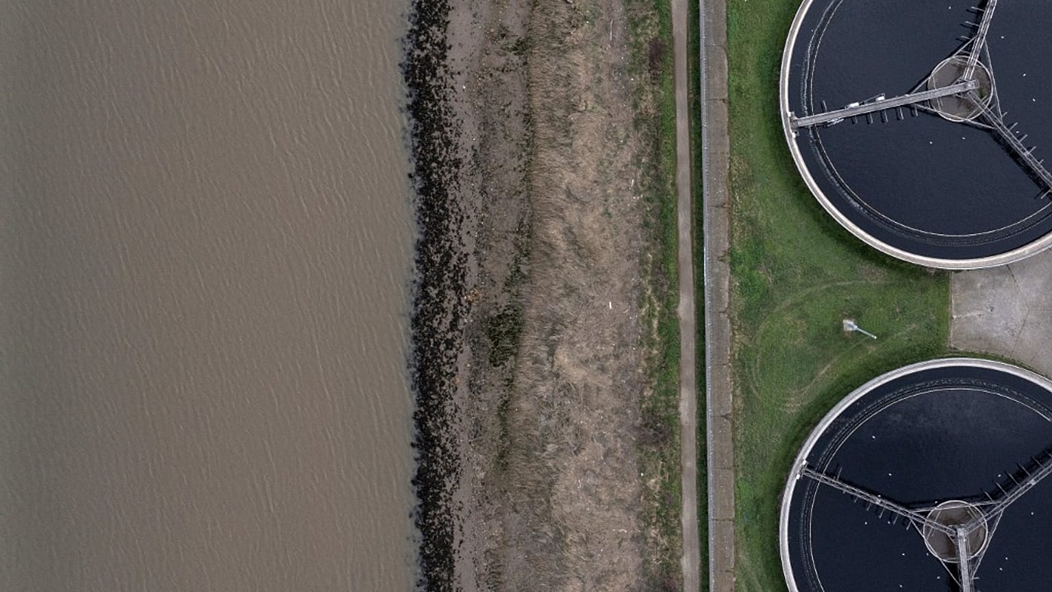 Sedimentation tanks at the Thames Water Long Reach water treatment facility on the banks of the Thames estuary in Dartford, east of London.