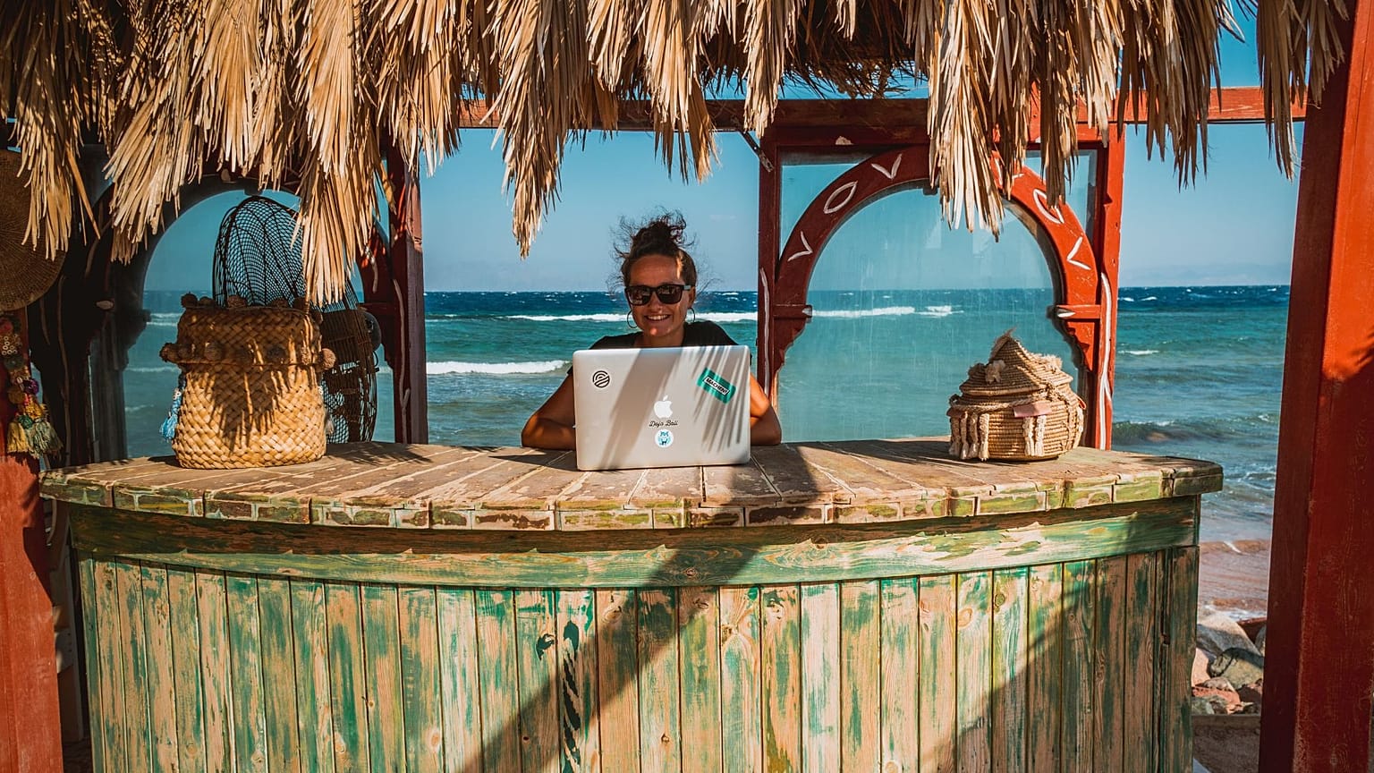 A digital nomad enjoys remote working from Dahab, Egypt