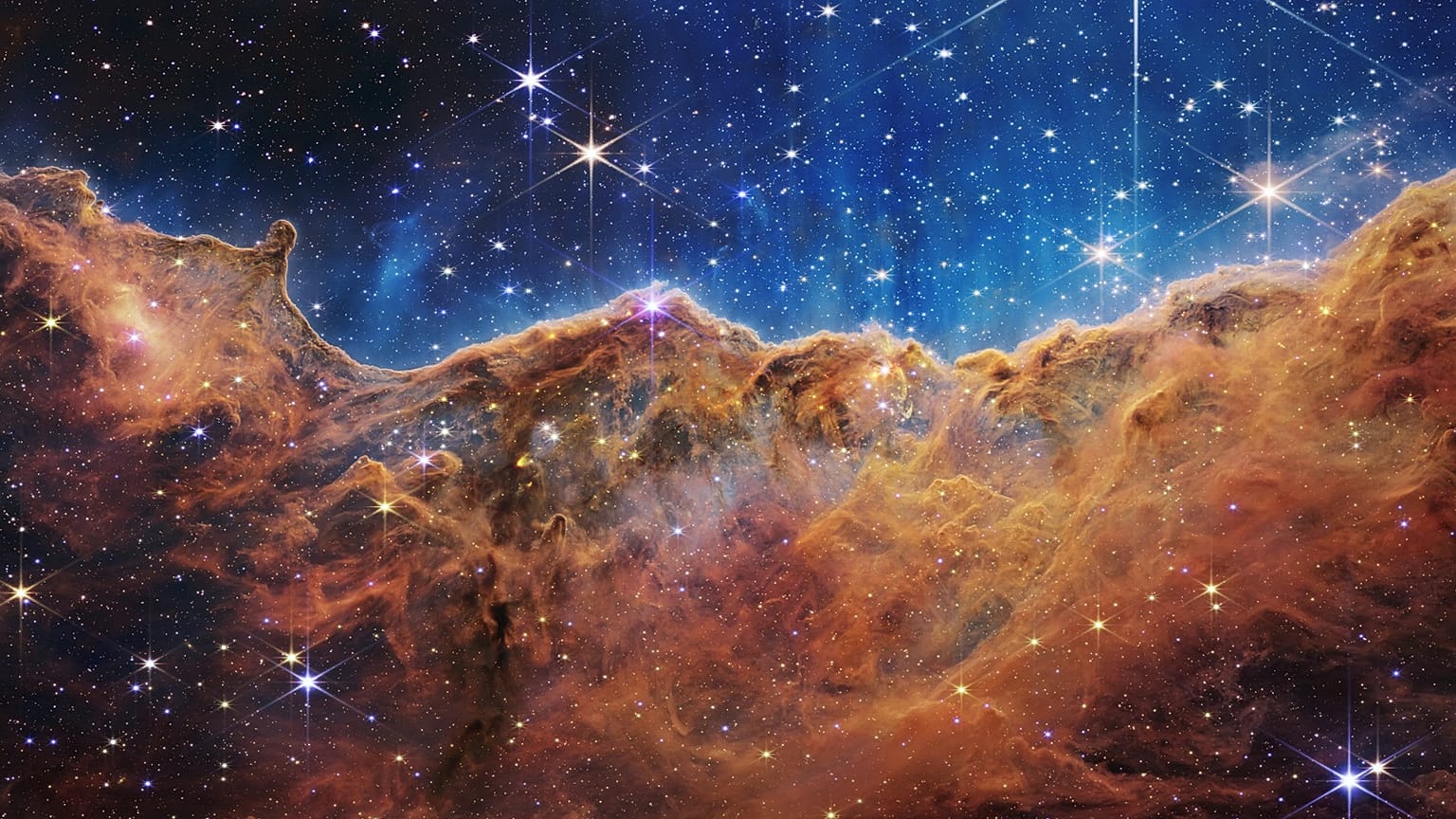 A borda de uma região próxima, jovem e formadora de estrelas NGC 3324 na Nebulosa Carina.