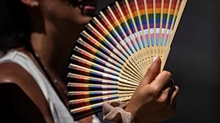 A woman fans herself in Madrid, Spain.