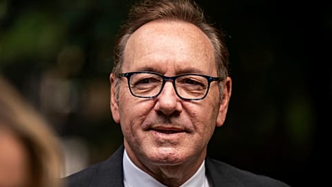 Actor Kevin Spacey looks on as he arrives at Southwark Crown Court, London